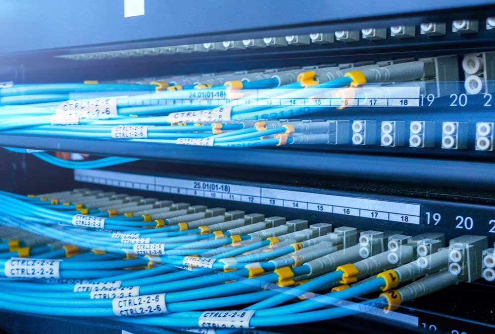 Fiber Optic Cables Plugged Into Patch Panel