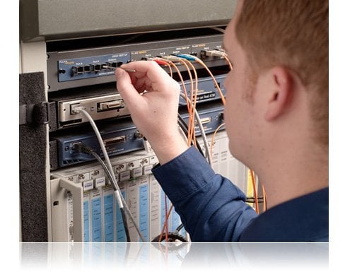 Technician Cleaning Fiber Optic Port with Swab