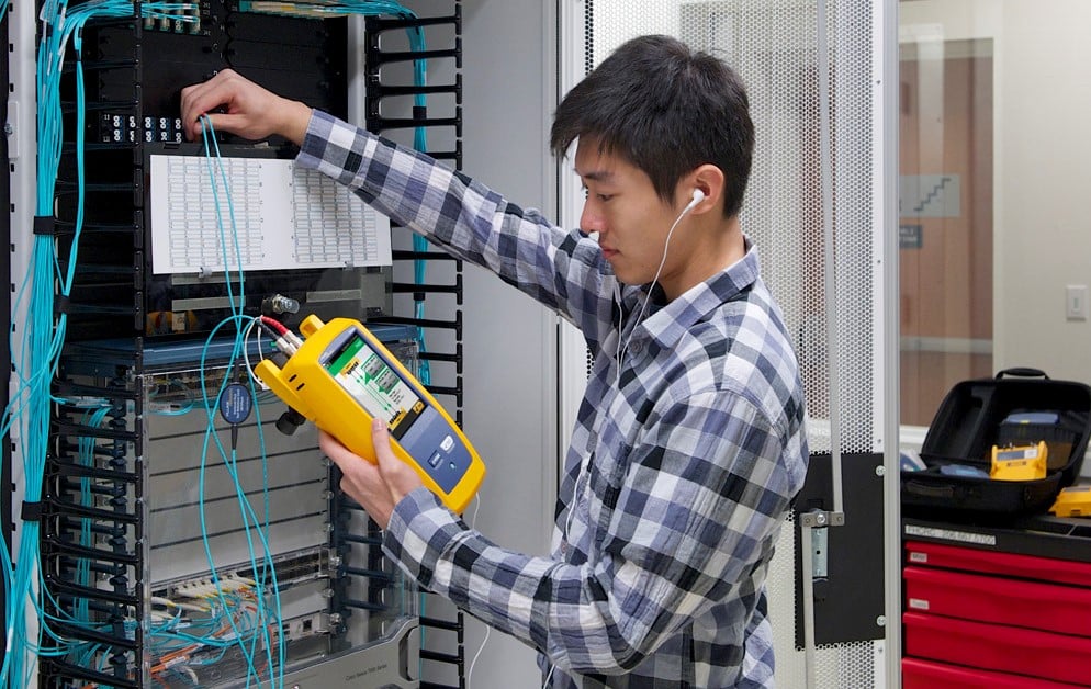 Technician Testing a Fiber Optic Network